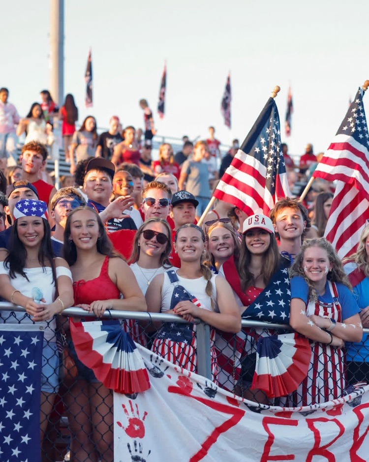 Student section in red, white, and blue. 