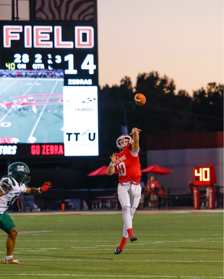 Football player throwing a pass.