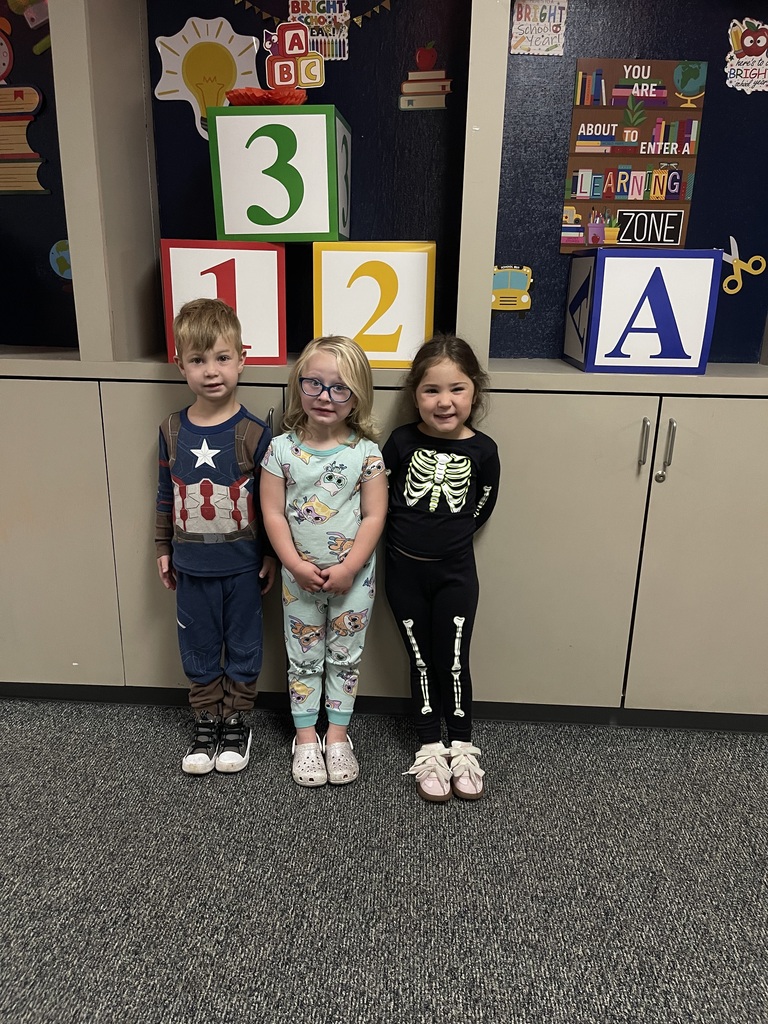 students smiling wearing pjs to school