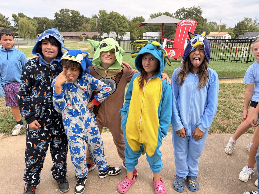 students smiling wearing pjs to school