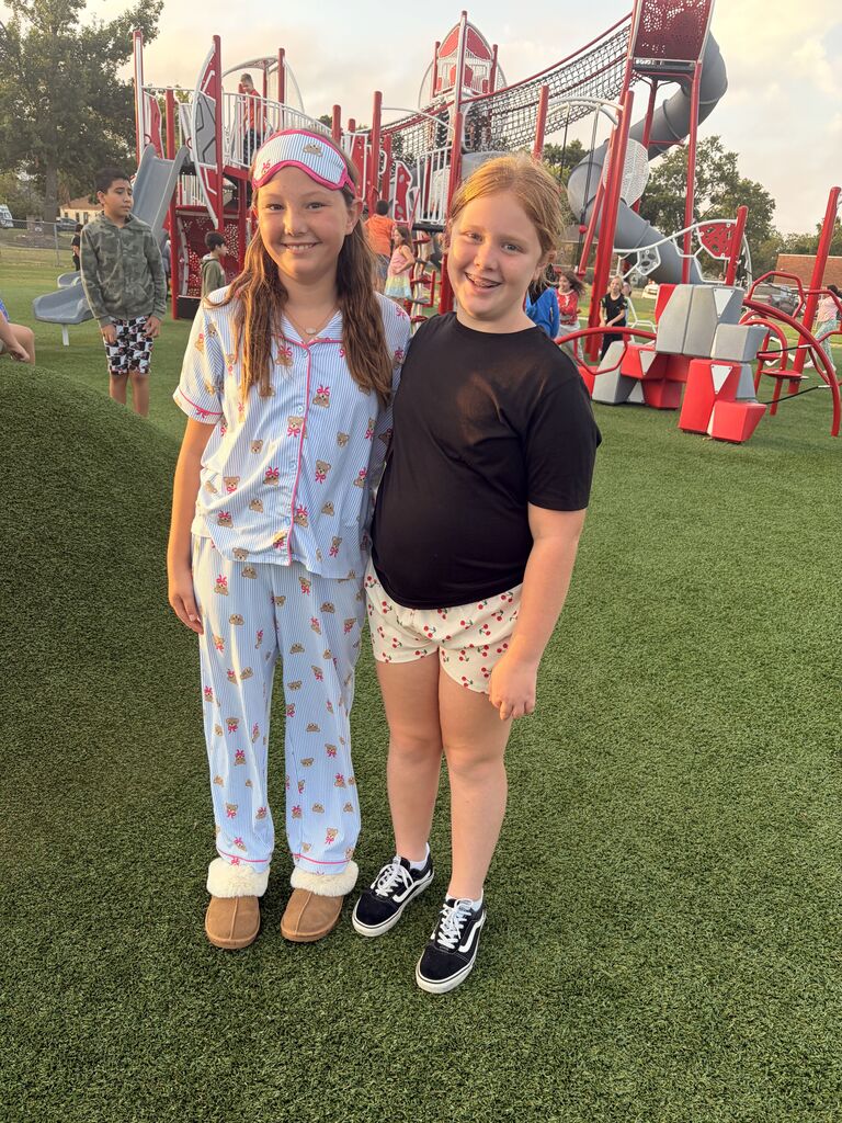 students smiling wearing pjs to school