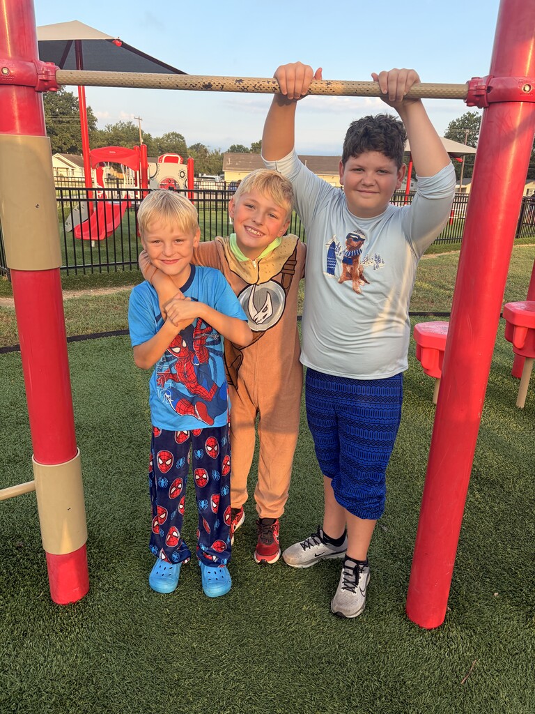 students smiling wearing pjs to school
