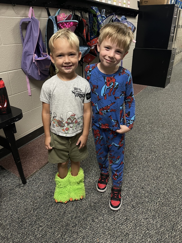 students smiling wearing pjs to school