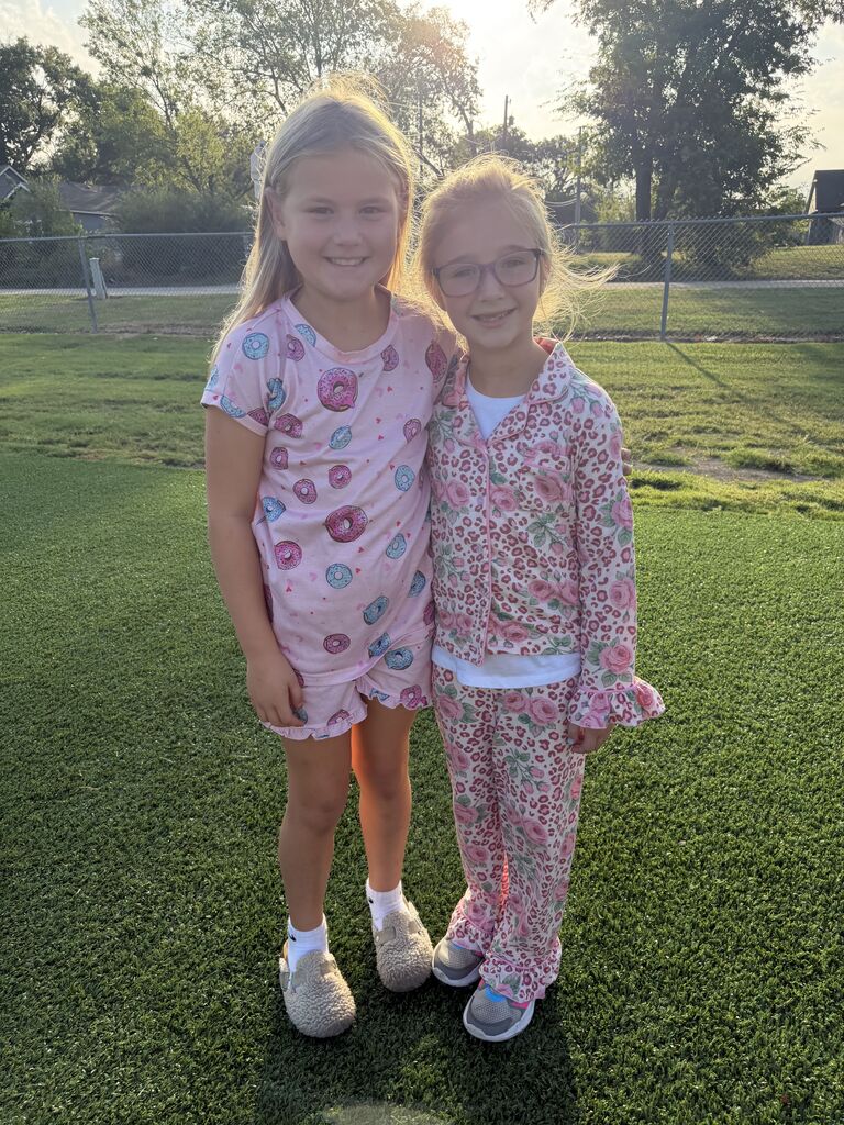 students smiling wearing pjs to school