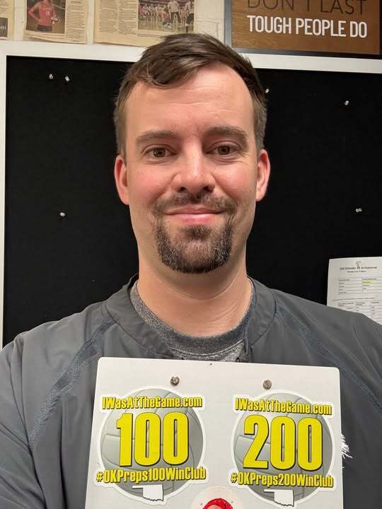 Derek Jackson holding OKPreps200WinClub Sicker and OKPreps100WinClub sticker