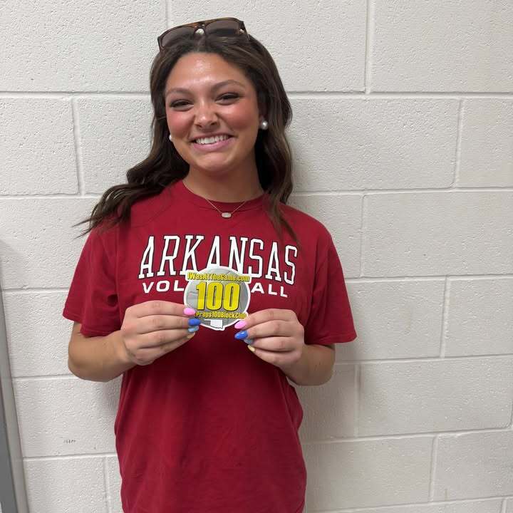 Addison Doyle holding OKPreps100BlockClub Sticker