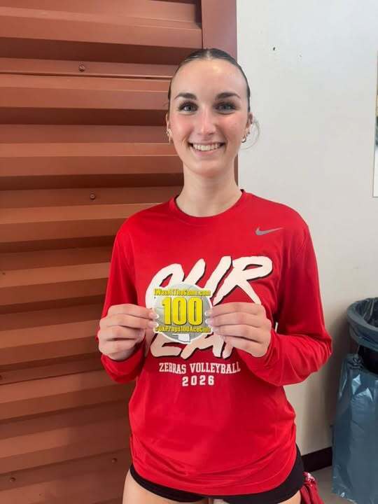 Grace Baughman holding OKPreps100AceClub sticker