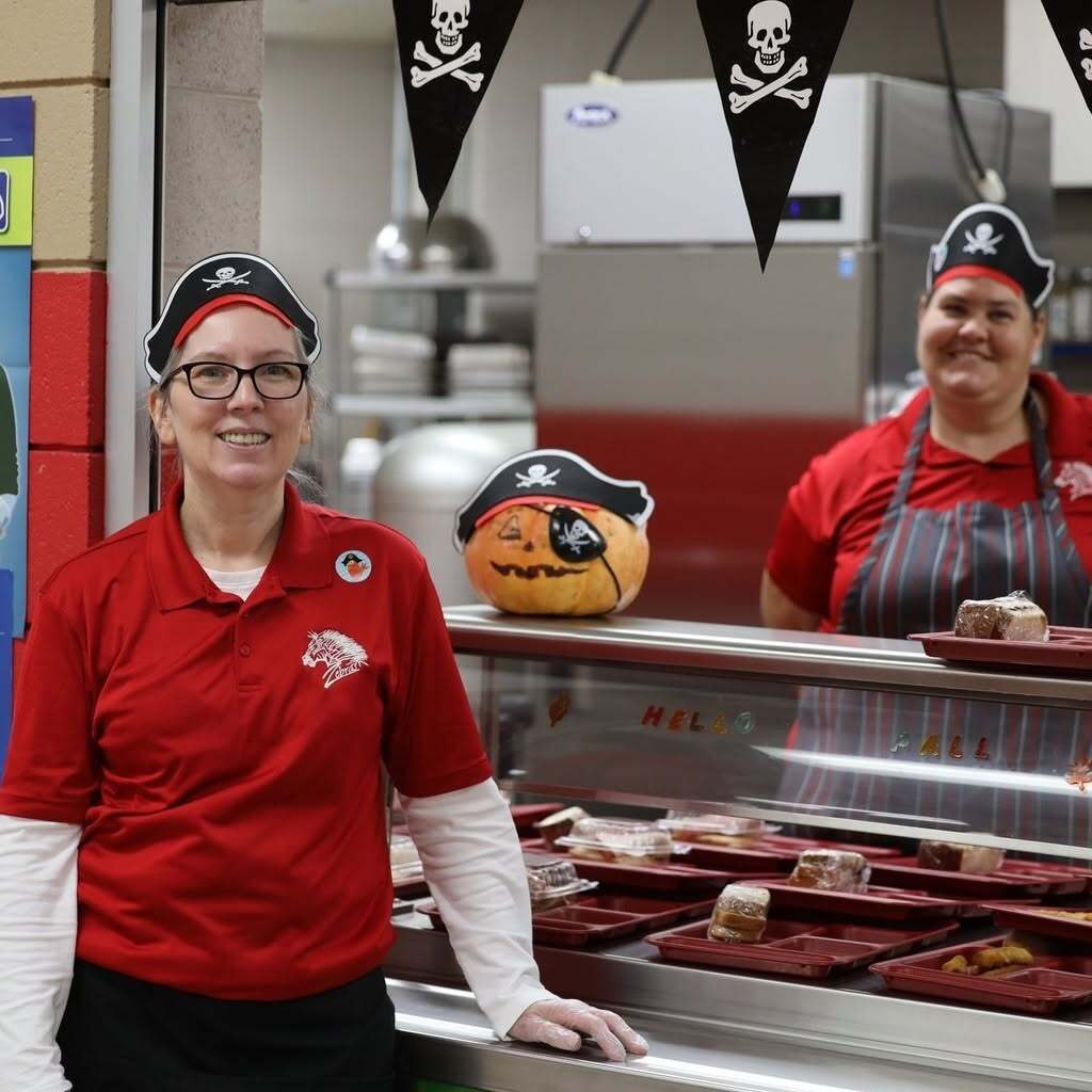 Cafeteria staff with pirate hats 