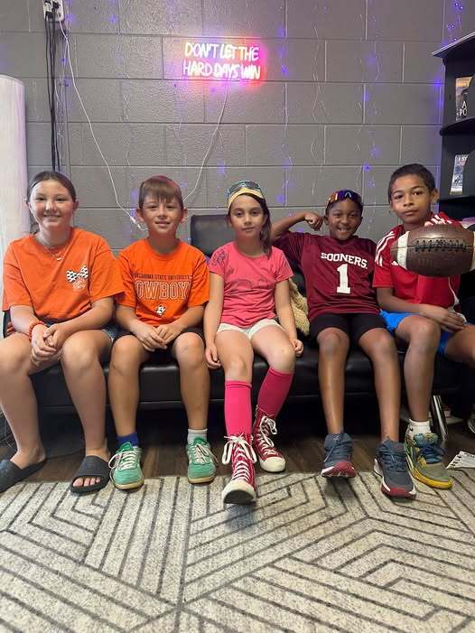 students wearing ou and osu gear