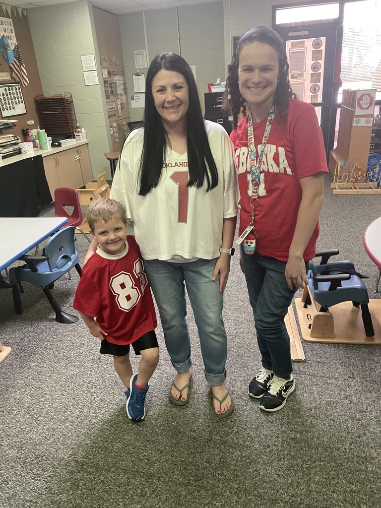 student and staff members smiling