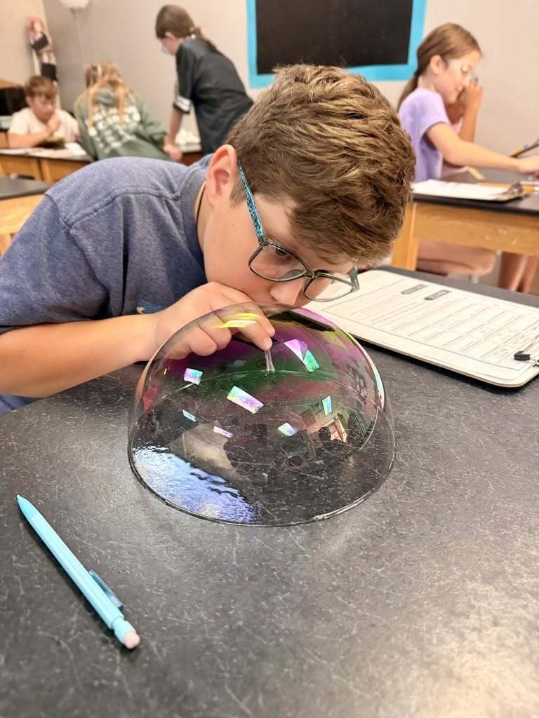 Student creating a buttle on the lab table.
