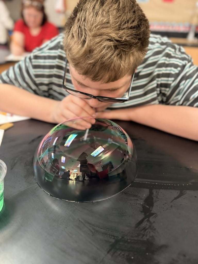 Student creating a buttle on the lab table.