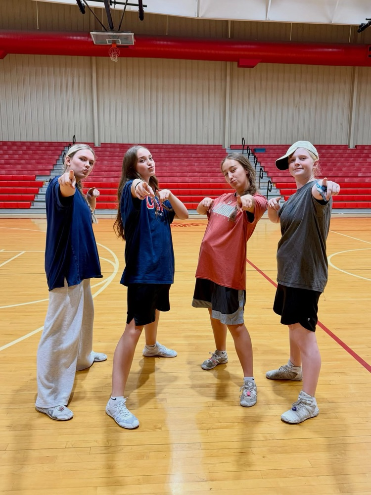 cheerleaders in basketball shorts and big T-shirts 