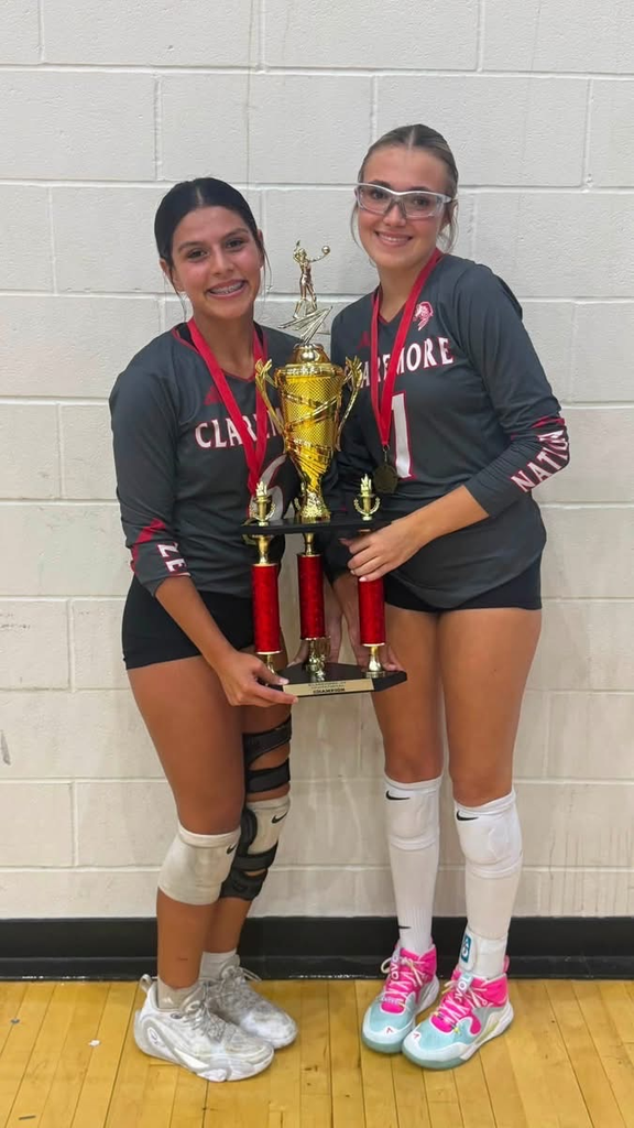 volleyball players with trophy