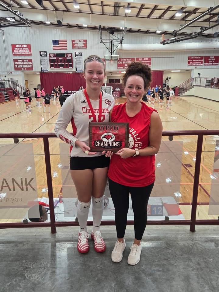 volleyball players with trophy