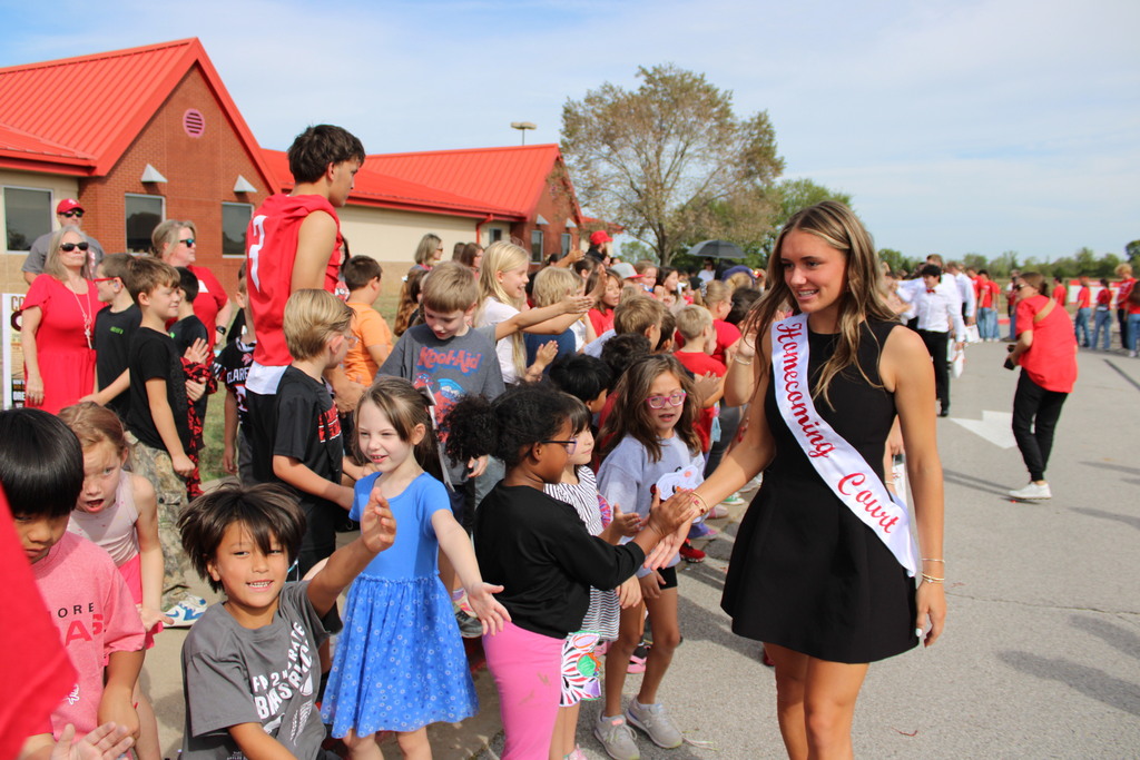 Court member high-fiving  students