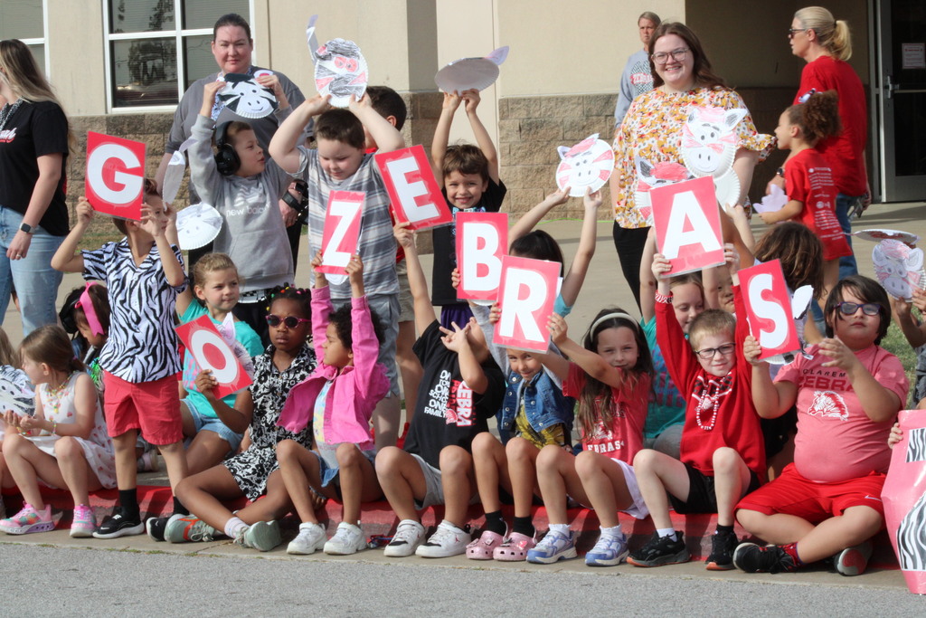 Students holing up Zebra signs