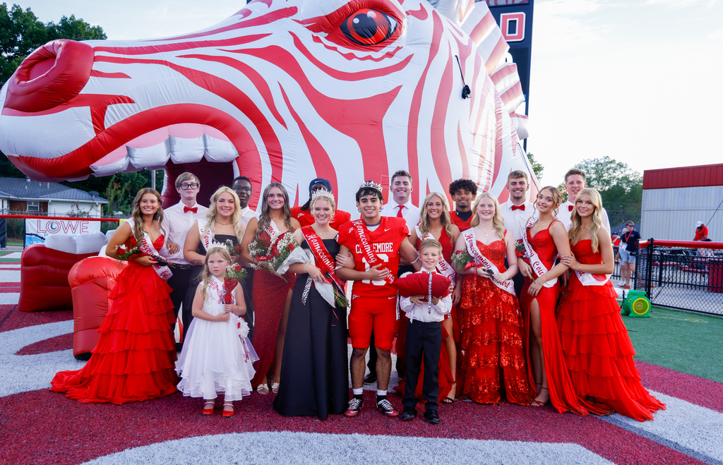 Homecoming court in front of zebra head