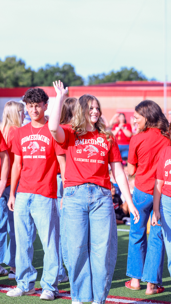 Homecoming Rep waving at students