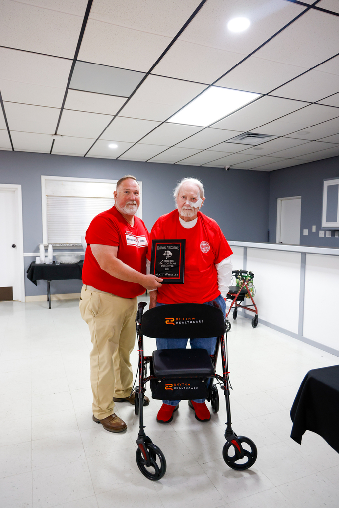Tom Hedgepath receiving Hall of Fame plaque with Bryan Frazier  