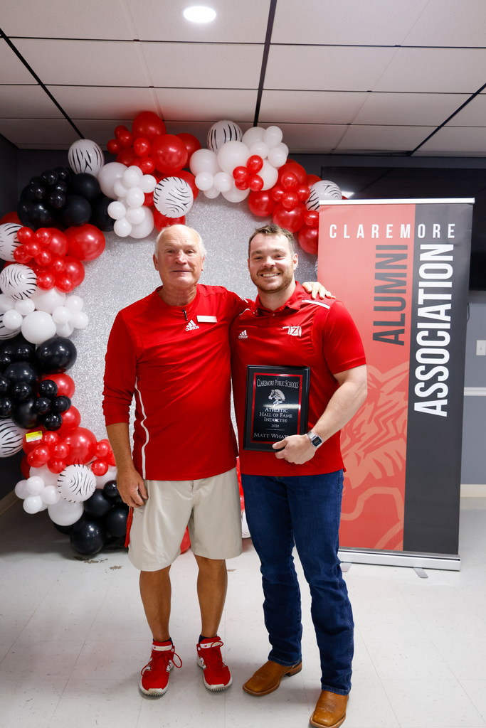 Matt Whatley receiving Hall of Fame plaque with Bryan Frazier  