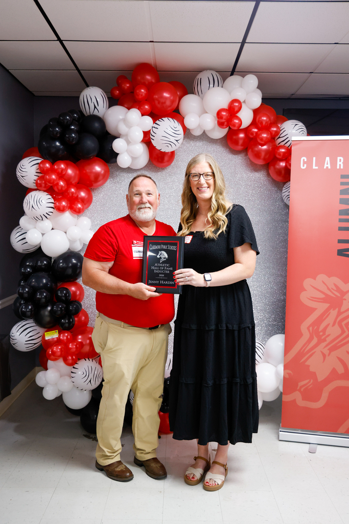 Jenny Hardin receiving Hall of Fame plaque with Bryan Frazier  