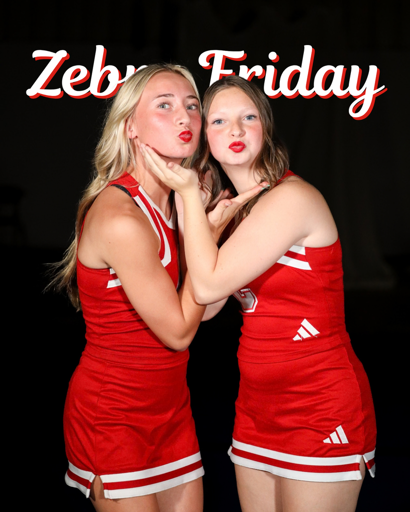 Two Zebra cheerleaders posed together in uniform.