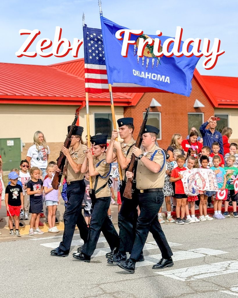 NJROTC cadets carry the American and Oklahoma flags during the Homecoming tour.
