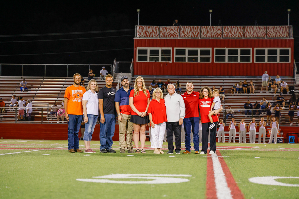 All of the 2026 hall of fame inductees and their families on the field 