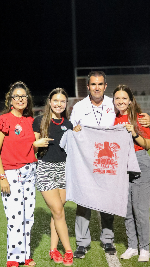 Coach Hurt celebrates his 100th career win with his family.