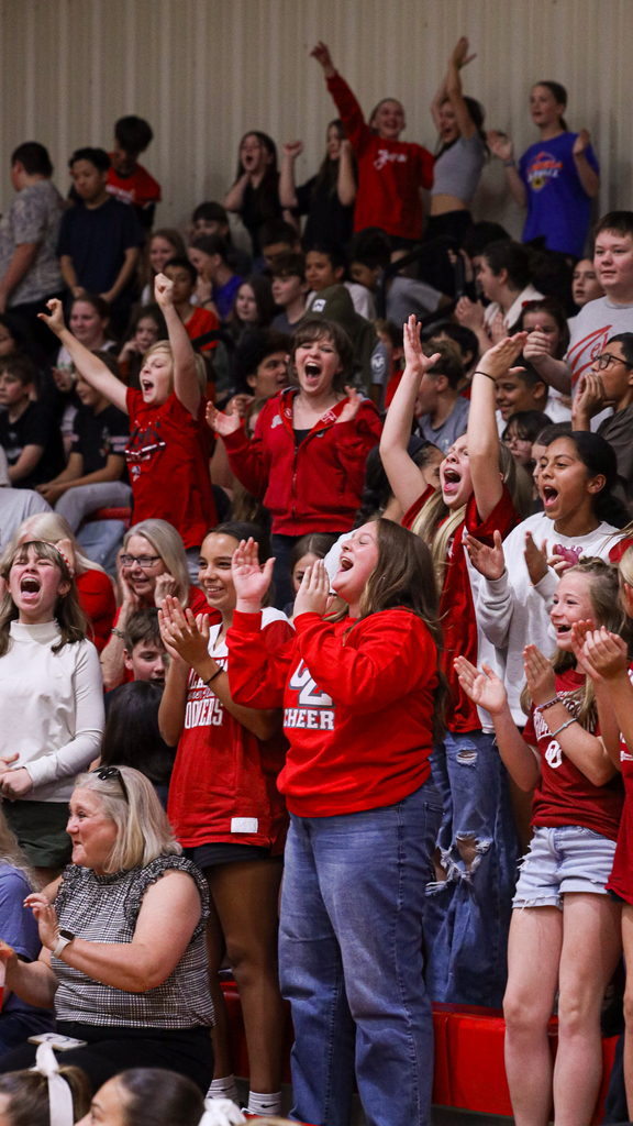 WRJH students cheer and clap from the stands.