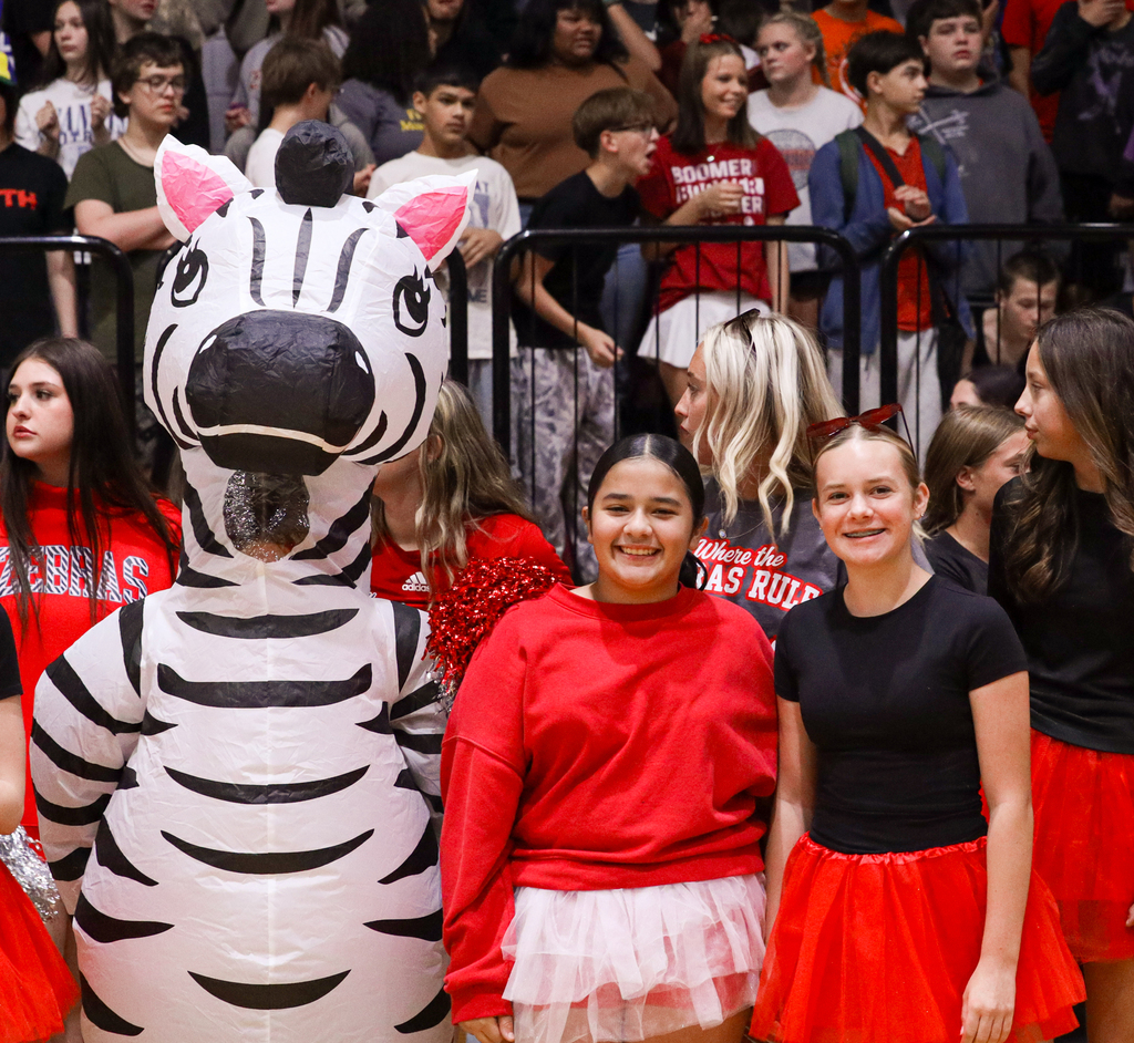 WRJH students pose with the Zebra mascot during the Homecoming assembly.