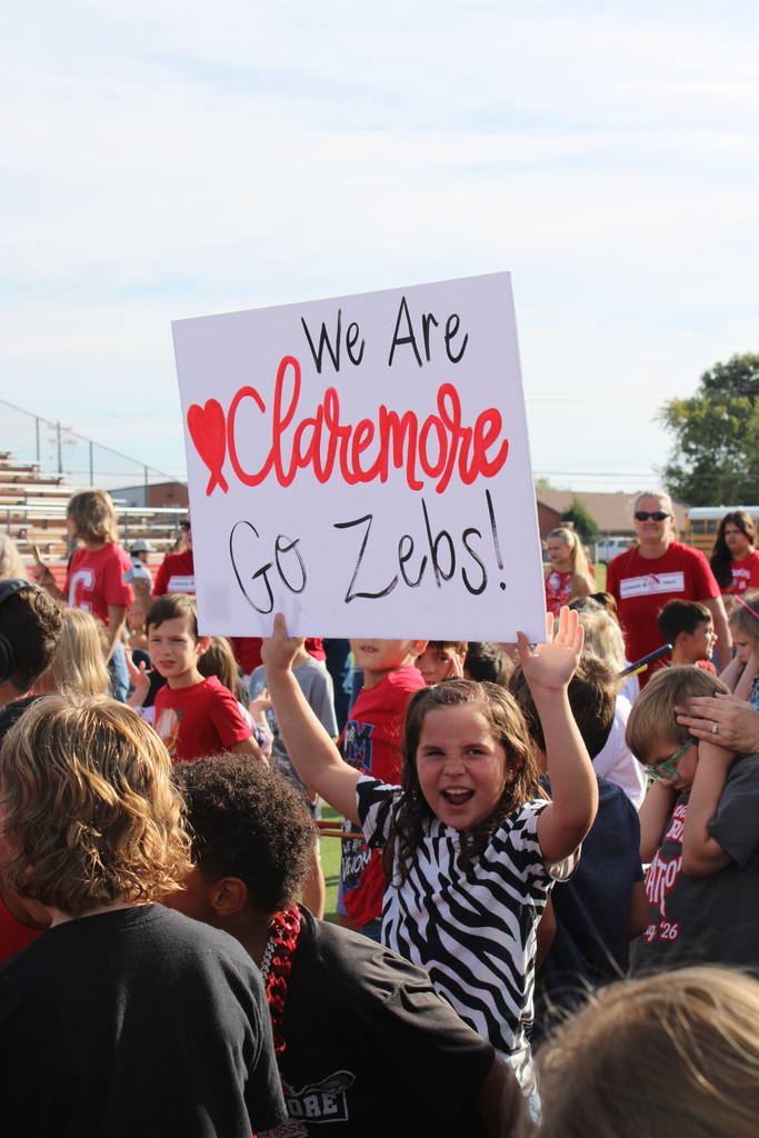 student holding signs