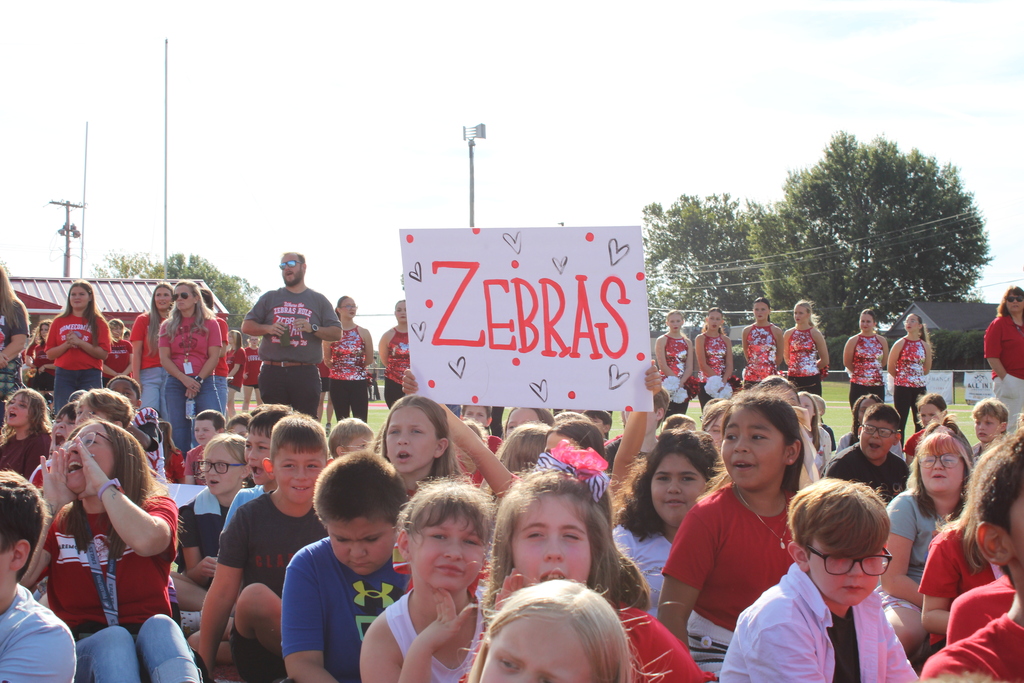 student holding zebra signs