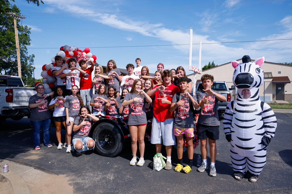 Freshman class members pose with their Homecoming float.