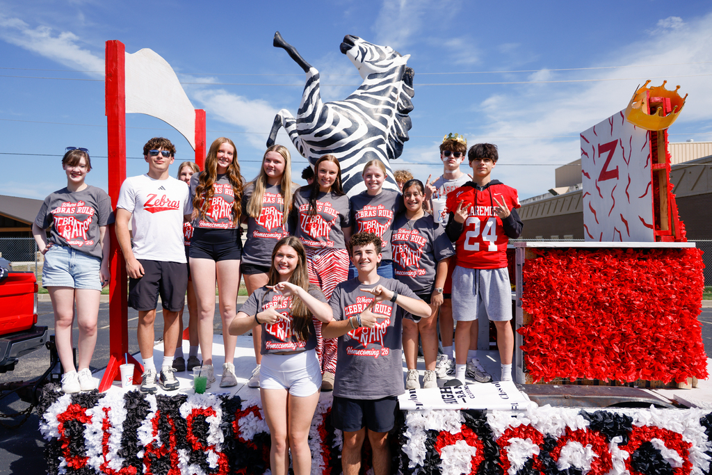 Sophomore class members pose with their Homecoming float.