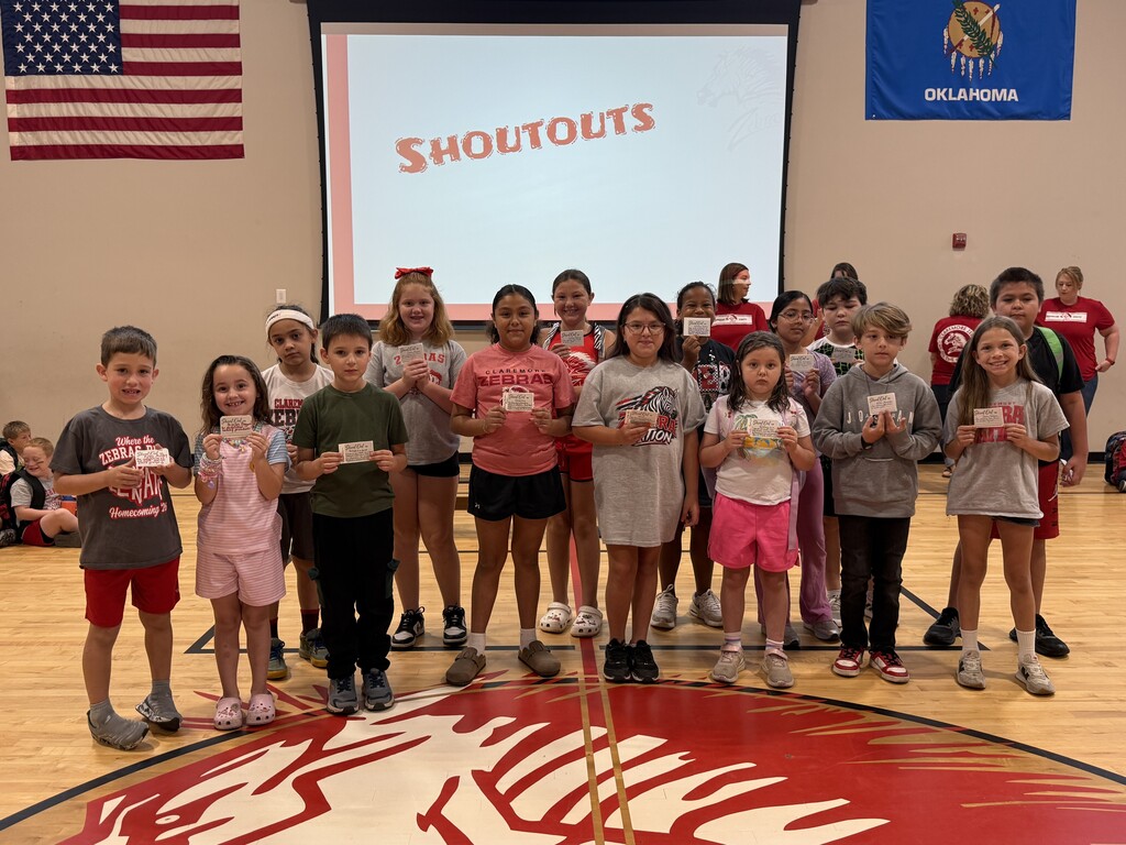 15 students smiling with their shout outs
