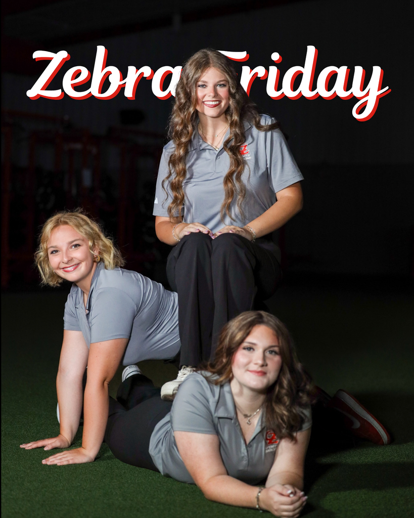 Three student athletic training aides pose together in gray polos.