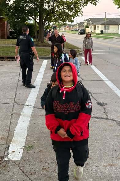 student smiling on walk to school