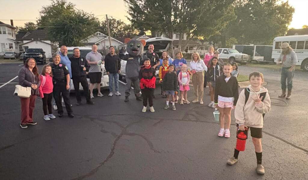 community members walking to school and smiling