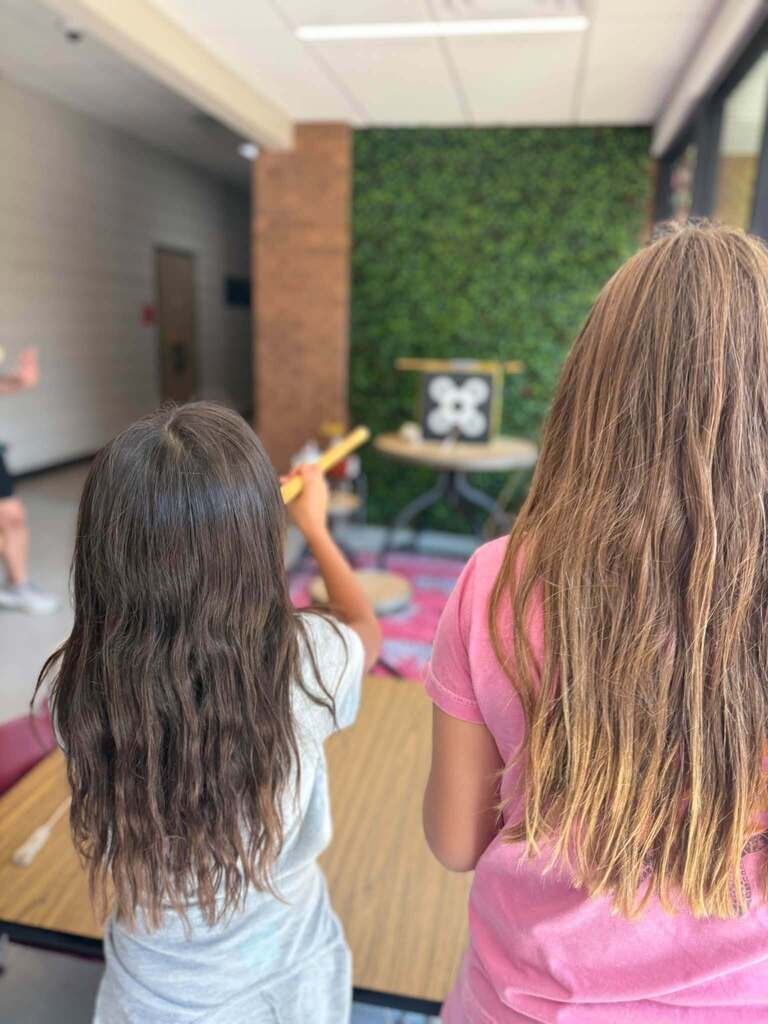 2 students participating in heritage day games