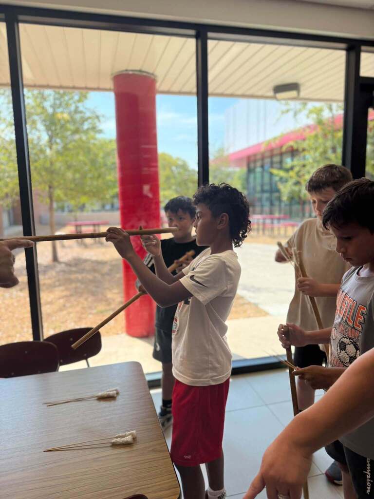 4 students participating in heritage day games
