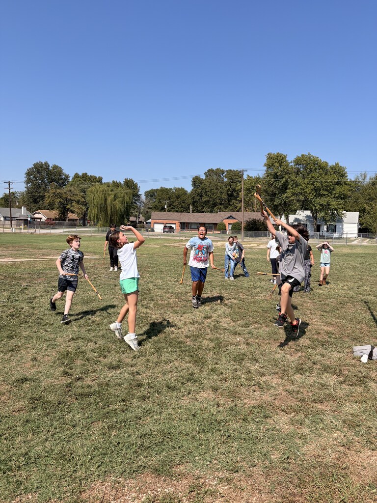 students playing Cherokee heritage days outside