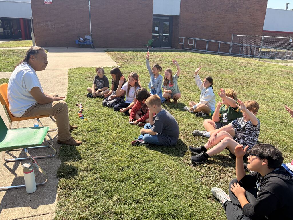 students smiling and playing Cherokee heritage games