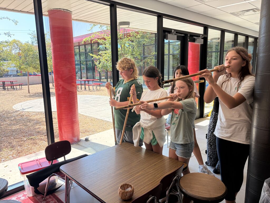 students smiling and playing Cherokee heritage games