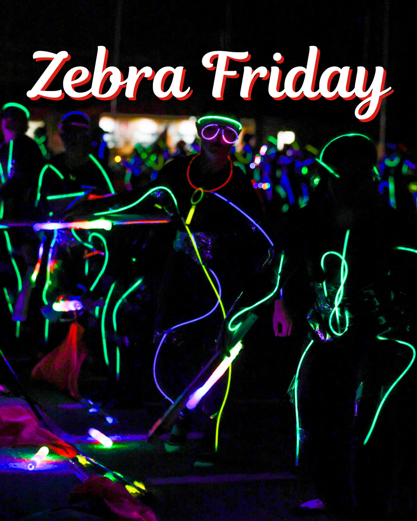 Claremore band members wear colorful glow lights on a Zebra Friday graphic.