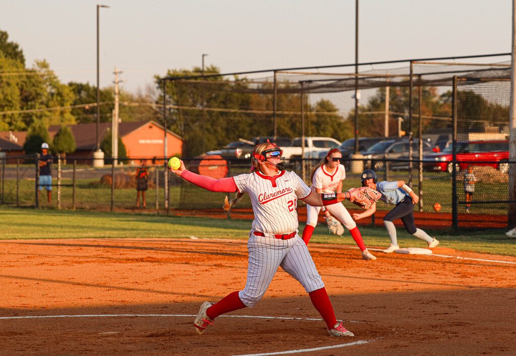 Claremore pitcher winds up to throw the softball.