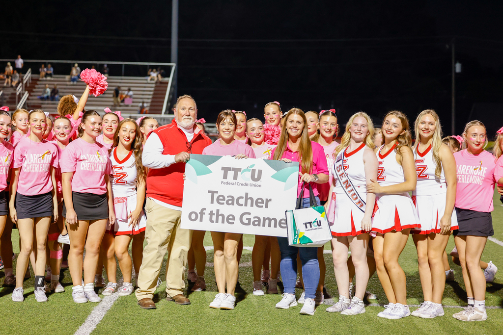 CHS math teacher Kylie James is recognized as TTCU Teacher of the Game alongside Superintendent Bryan Frazier, Principal Mrs. Lee, and Claremore cheerleaders.