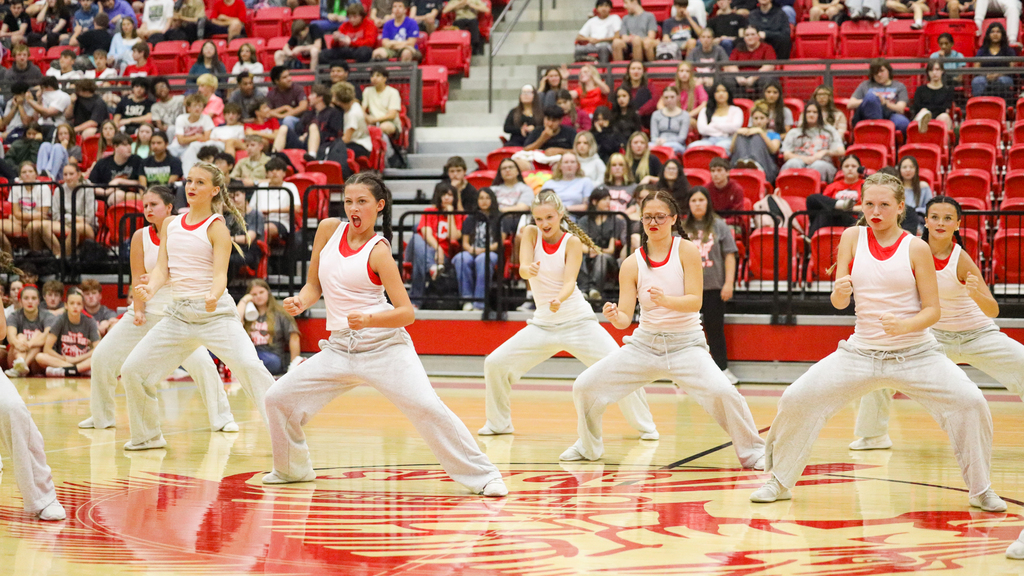 CHS dance team in Eminem inspired costumes preforming at the CHS homecoming assembly