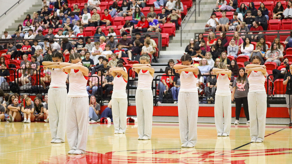 CHS dance team in Eminem inspired costumes preforming at the CHS homecoming assembly